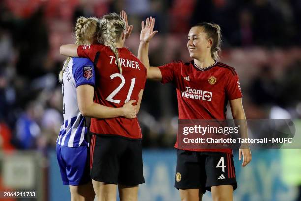 Millie Turner of Manchester United reacts to Maria Thorisdottir of Brighton with Maya Le Tissier at the end of the Adobe Women's FA Cup Quarter Final...
