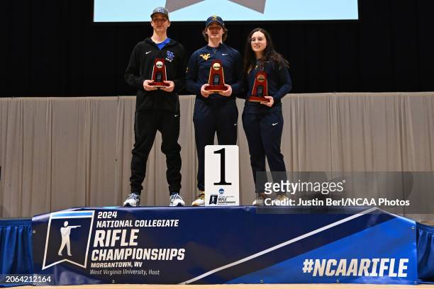The Top 3 competitors in Air Rifle pose with their trophies during the Division I Men's and Women's Rifle Championship at WVU Coliseum on March 9,...