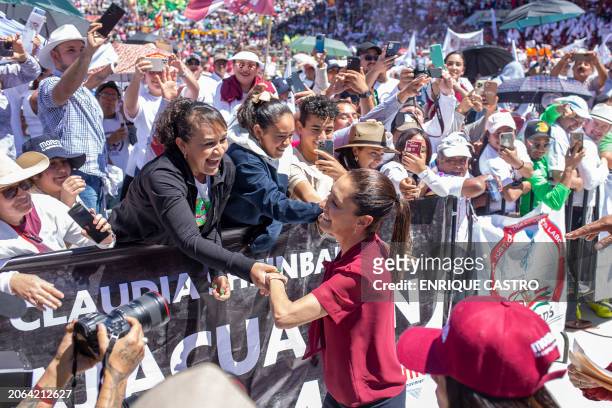 Mexican leftist presidential candidate Claudia Sheinbaum greets supporters upon arrival at a campaign rally at the Morelos stadium in Morelia,...