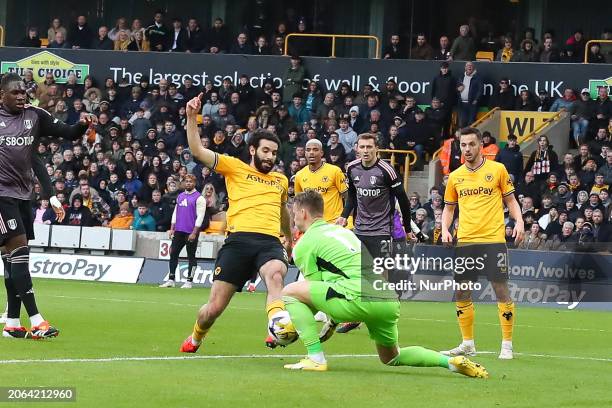 Rayan Ait-Nouri of Wolves is missing a chance against Bernd Leno, goalkeeper of Fulham, during the Premier League match between Wolverhampton...