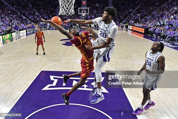 Jerrell Colbert of the Kansas State Wildcats blocks the shot of Hason Ward of the Iowa State Cyclones in the second half at Bramlage Coliseum on...