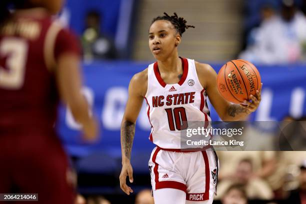 Aziaha James of the NC State Wolfpack dribbles up court against the Florida State Seminoles during the second half of the game in the Semifinals of...