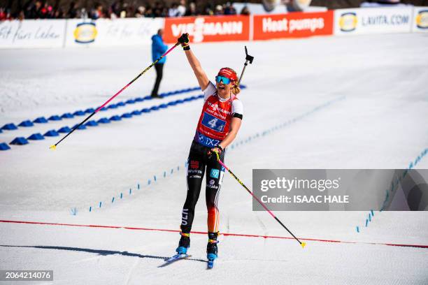 Germany's Elvira Oeberg celebrates her team's second-place finish at the end of the women's 4x6-km relay of the IBU Biathlon World Cup at the Soldier...