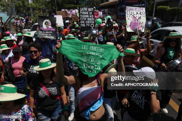 Demonstrators march carrying green Pro-Choice posters and scarves during a demonstration a day after International Women's Day on March 9, 2024 in...