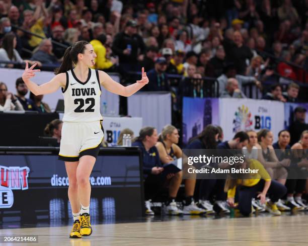 Caitlin Clark of the Iowa Hawkeyes celebrates a three point shot against the Michigan Wolverines in the Semifinal Round of the Big Ten Tournament at...