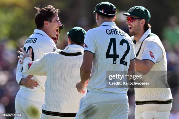 Pat Cummins of Australia is congratulated by team mates after dismissing Tom Latham of New Zealand during day three of the Second Test in the series...