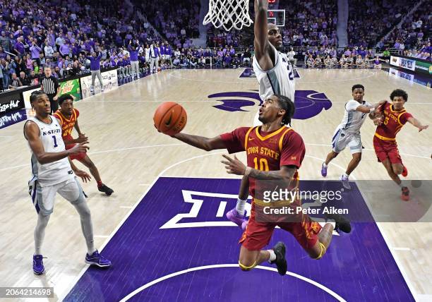 Keshon Gilbert of the Iowa State Cyclones drives to the basket against Arthur Kaluma of the Kansas State Wildcats in the second half at Bramlage...