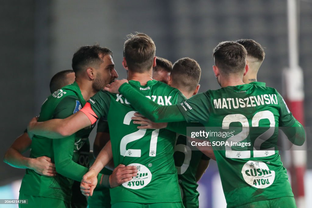 Players of Warta Poznan celebrate after scoring a goal...