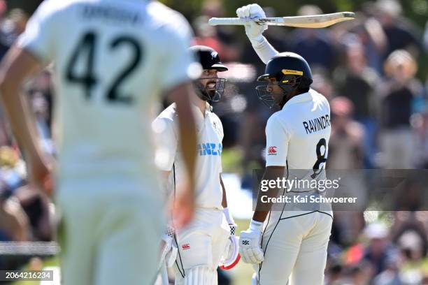 Daryl Mitchell of New Zealand looks on as Rachin Ravindra of New Zealand celebrates his half century during day three of the Second Test in the...