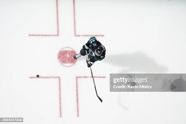 An overhead view as Marc-Edouard Vlasic of the San Jose Sharks skates during warmups before the game against the Ottawa Senators at SAP Center on...