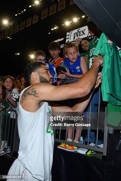 Jayson Tatum of the Boston Celtics signs autographs before the game against the Phoenix Suns on March 9, 2024 at Footprint Center in Phoenix,...