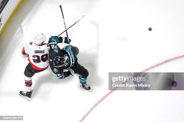 An overhead view as William Eklund of the San Jose Sharks battles for the puck in the first period against Claude Giroux of the Ottawa Senators at...