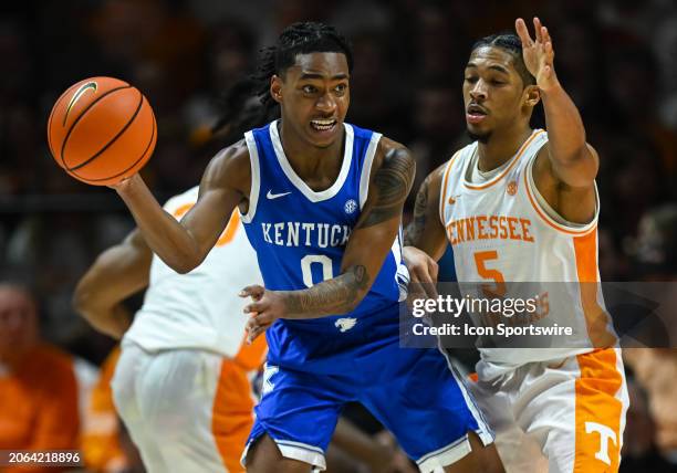 Kentucky Wildcats guard Rob Dillingham controls the ball against Tennessee Volunteers guard Zakai Zeigler during the college basketball game between...