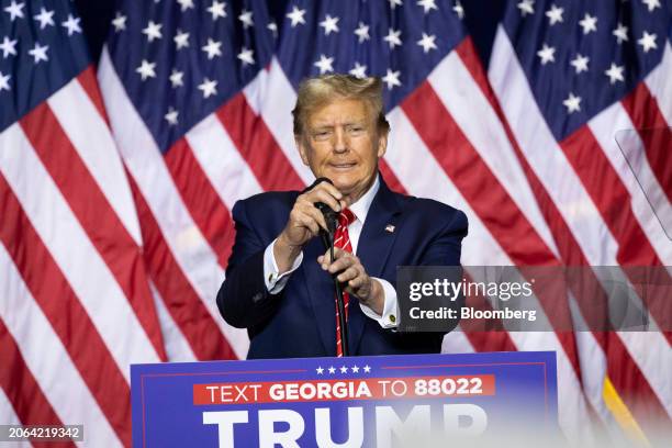 Former US President Donald Trump arrives to speak during a "Get Out The Vote" rally at the Forum River Center in Rome, Georgia, US, on Saturday,...