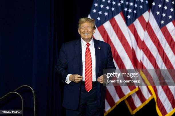 Former US President Donald Trump arrives to speak during a "Get Out The Vote" rally at the Forum River Center in Rome, Georgia, US, on Saturday,...