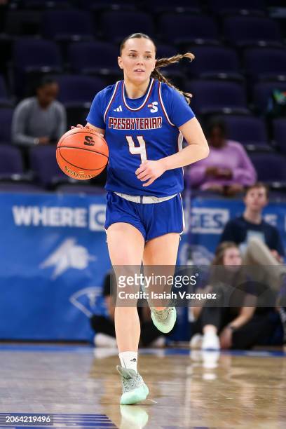 Tilda Sjokvist of the Presbyterian Blue Hose moves the ball against the High Point Panthers during the Big South Women's Basketball tournament at...