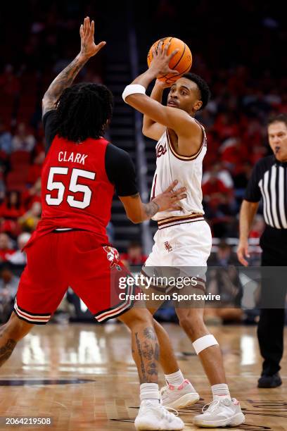 Boston College Eagles guard Claudell Harris Jr. Looks to make a pass over Louisville Cardinals guard Skyy Clark during a mens college basketball game...