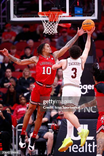 Louisville Cardinals forward Kaleb Glenn goes for the block of Boston College Eagles guard Jaeden Zackery shot during a mens college basketball game...