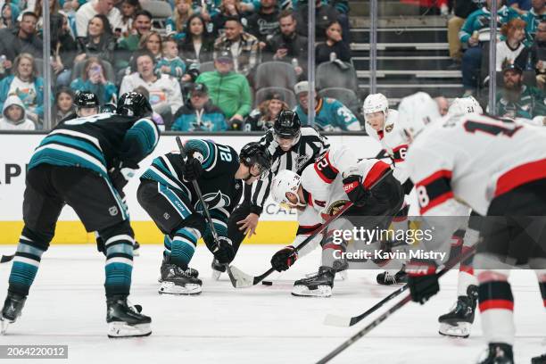 William Eklund of the San Jose Sharks takes a face-off in the second period against Claude Giroux of the Ottawa Senators at SAP Center on March 9,...