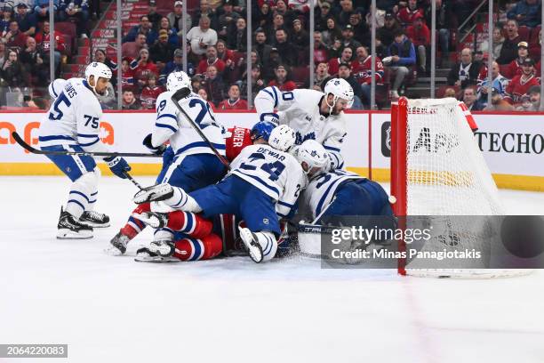 Players pile up onto goaltender Ilya Samsonov of the Toronto Maple Leafs during the second period against the Montreal Canadiens at the Bell Centre...