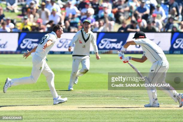 Australia's Josh Hazlewood celebrates the wicket of New Zealand's Daryl Mitchell on day three of the second Test cricket match between New Zealand...