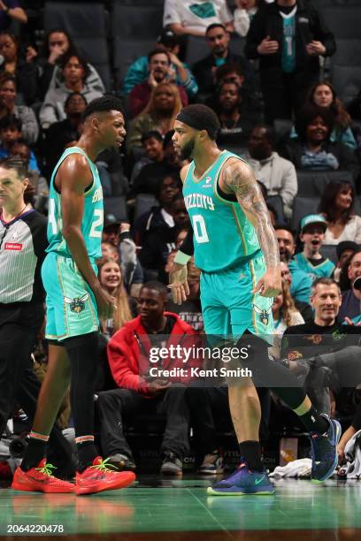 Brandon Miller of the Charlotte Hornets celebrates a play by Miles Bridges during the game against the Brooklyn Nets on March 9, 2024 at Spectrum...