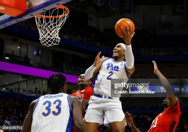 Blake Hinson of the Pittsburgh Panthers attempts a shot against the North Carolina State Wolfpack in the second half at Petersen Events Center on...