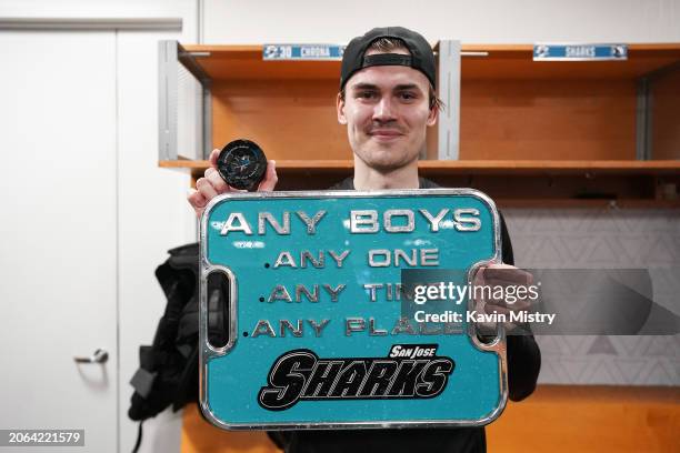 Magnus Chrona of the San Jose Sharks holds up the puck from his first NHL win against the Ottawa Senators at SAP Center on March 9, 2024 in San Jose,...
