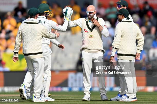 Nathan Lyon of Australia is congratulated by team mates after dismissing Glenn Phillips of New Zealand during day three of the Second Test in the...