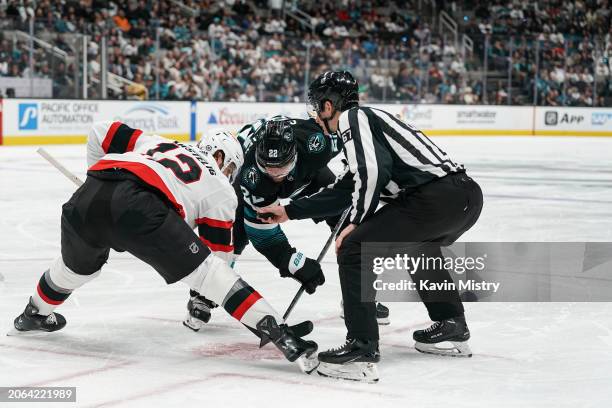 Ryan Carpenter of the San Jose Sharks takes a face-off against Mark Kastelic of the Ottawa Senators in the third period at SAP Center on March 9,...