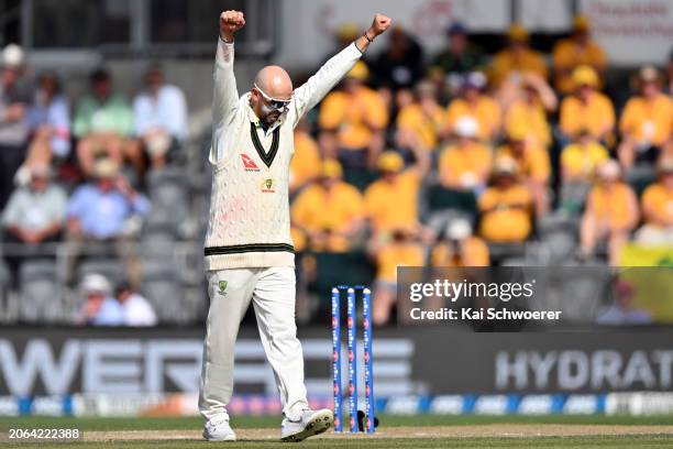 Nathan Lyon of Australia celebrates after dismissing Glenn Phillips of New Zealand during day three of the Second Test in the series between New...