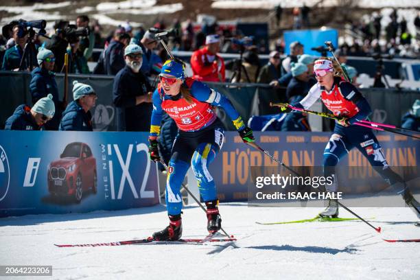 Ukraine's Anastasiya Merkushyna skis after shooting in the women's 4x6-km relay during the IBU Biathlon World Cup at Soldier Hollow Nordic Center in...