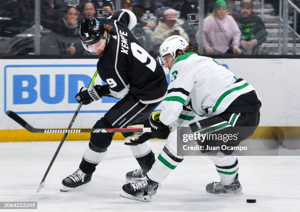 Adrian Kempe of the Los Angeles Kings and Chris Tanev of the Dallas Stars battle for position during the first period at Crypto.com Arena on March 9,...