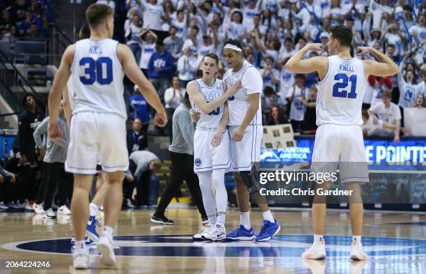 Spencer Johnson of the Brigham Young Cougars celebrates with teammate Aly Khalifa as teammates Dallin Hall and Trevin Knell join during the second...