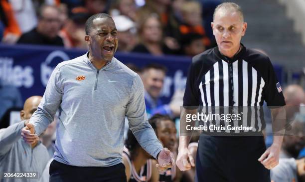 Mike Boynton Jr., head coach of the Oklahoma State Cowboys shouts at referee Kelly Self during the first half of their game against the Brigham Young...