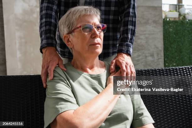 adult son visiting his elderly mother at home - dementia stock pictures, royalty-free photos & images