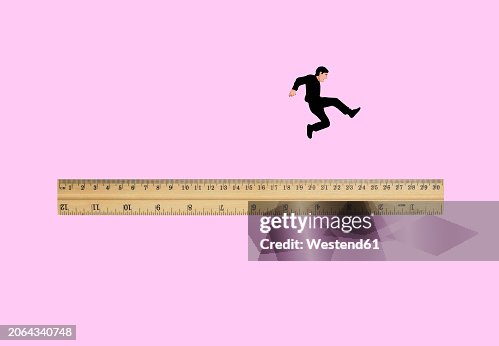 Man Jumping Off Oversized Ruler High-Res Vector Graphic - Getty Images