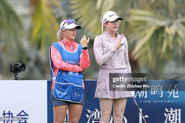 Paula Creamer of the United States and her caddie study a tee shot on the 10th hole during the first round of the Blue Bay LPGA at Jian Lake Blue Bay...