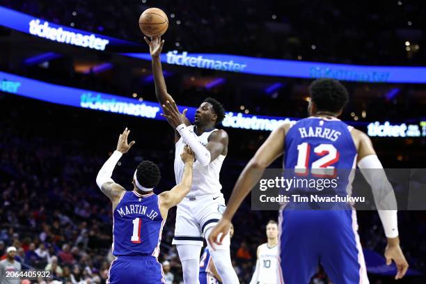 Jaren Jackson Jr. #13 of the Memphis Grizzlies shoots over KJ Martin of the Philadelphia 76ers during the first quarter at the Wells Fargo Center on...