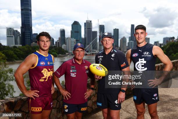 Lions head coach Chris Fagan and Cam Rayner pose with Carlton head coach Michael Voss and Adam Cerra during a 2024 AFL Opening Round Media...