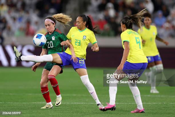 Aline Gomes of Brazil competes for the ball with Mayra Pelayo of Mexico in the second half during the 2024 Concacaf W Gold Cup semifinals at...