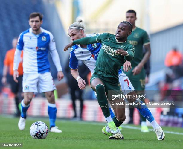 Plymouth Argyle's Bali Mumba holds off the challenge from Blackburn Rovers' Arnor Sigurdsson during the Sky Bet Championship match between Blackburn...