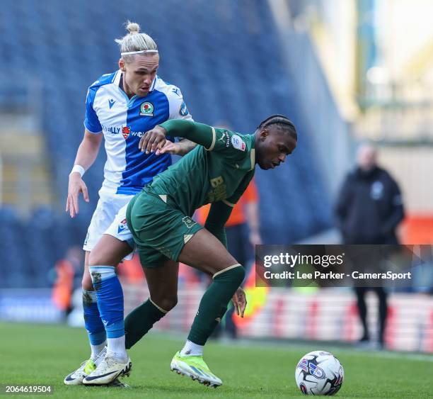 Plymouth Argyle's Bali Mumba holds off the challenge from Blackburn Rovers' Arnor Sigurdsson during the Sky Bet Championship match between Blackburn...