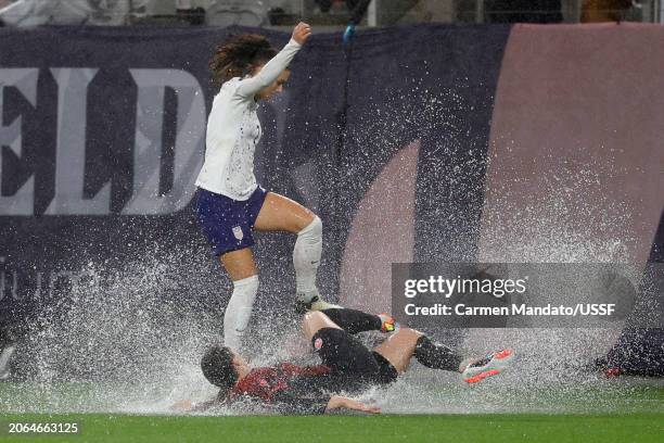 Vanessa Gilles of Canada goes for a tackle on Alex Morgan of the United States during the first half of the 2024 Concacaf W Gold Cup semifinals at...