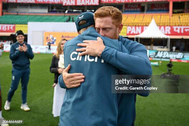 Jonathan Bairstow of England is presented with his 100th test cap by Joe Root ahead of day one of the 5th Test Match between India and England at...