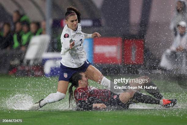 Alex Morgan of the United States and Vanessa Gilles of Canada collide in the first half during the 2024 Concacaf W Gold Cup semifinals at Snapdragon...
