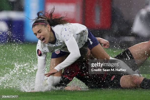 Alex Morgan of the United States and Vanessa Gilles of Canada collide in the first half during the 2024 Concacaf W Gold Cup semifinals at Snapdragon...