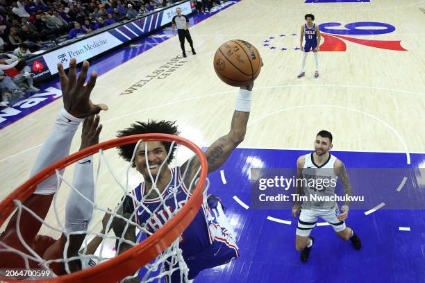 Kelly Oubre Jr. #9 of the Philadelphia 76ers elevates for a dunk during the third quarter against the Memphis Grizzlies at the Wells Fargo Center on...