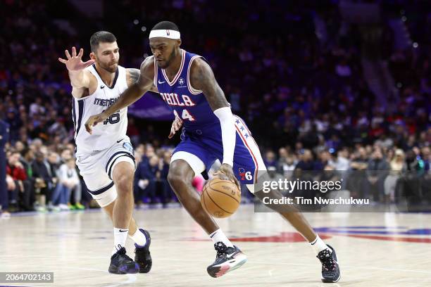 Paul Reed of the Philadelphia 76ers dribbles past John Konchar of the Memphis Grizzlies during the third quarter at the Wells Fargo Center on March...