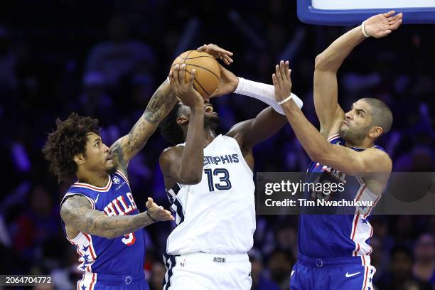 Kelly Oubre Jr. #9 of the Philadelphia 76ers blocks Jaren Jackson Jr. #13 of the Memphis Grizzlies during the third quarter at the Wells Fargo Center...